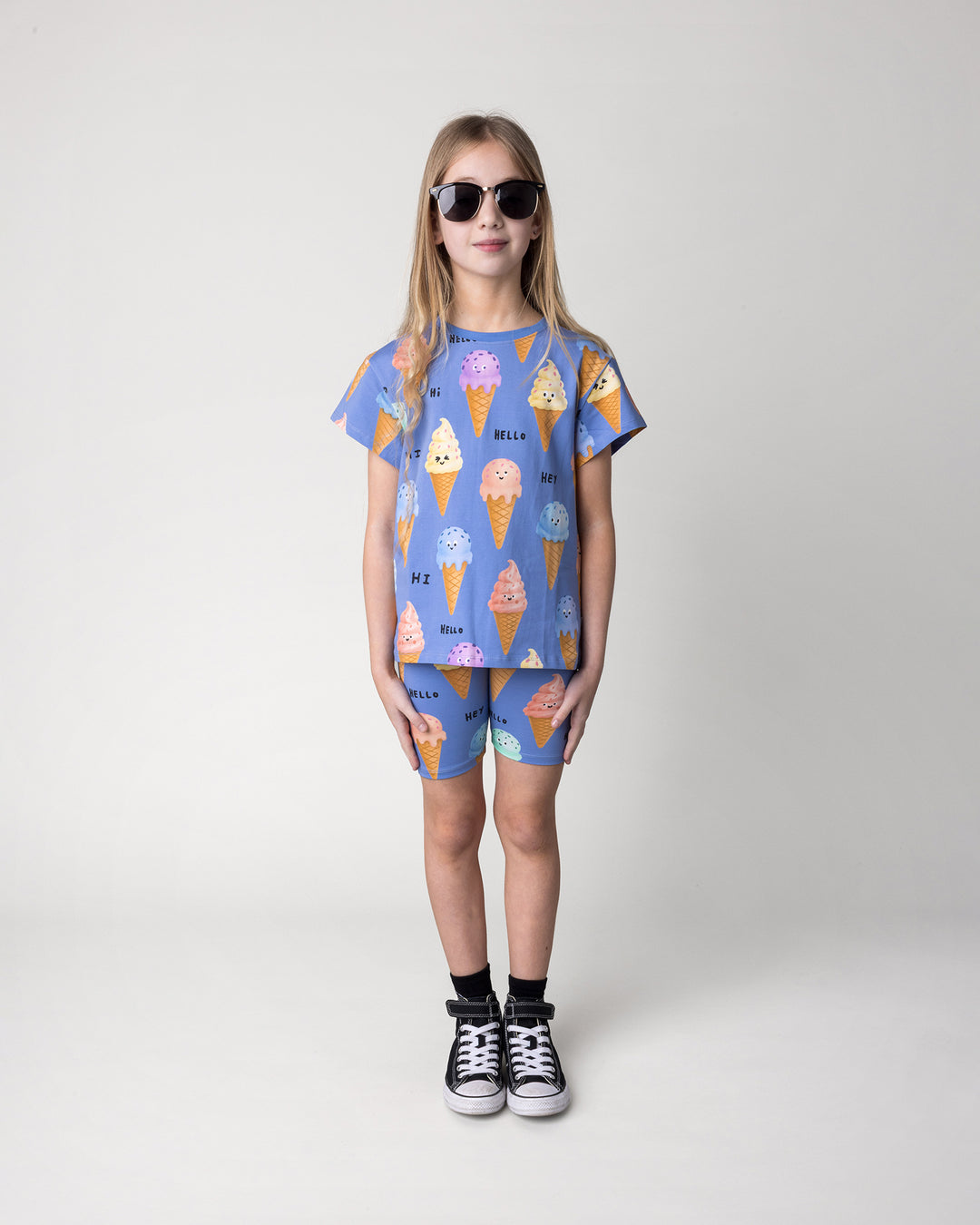 Kid wearing the Happy Icecreams Tee in cornflower with the Happy Icecreams Bike Pant in cornflower, front view