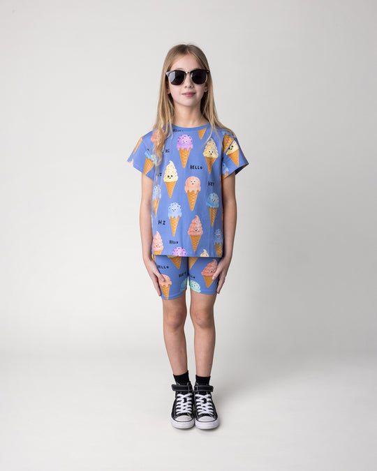 Kid wearing the Happy Icecreams Tee in cornflower with the Happy Icecreams Bike Pant in cornflower, front view