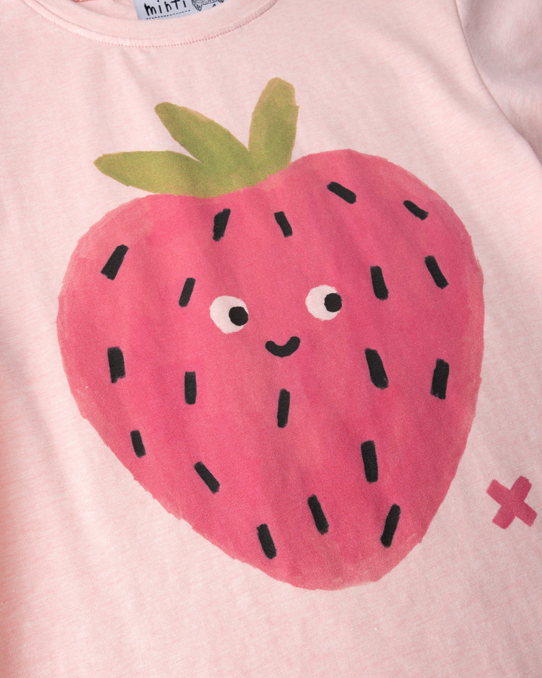 Close up of the Happy Strawberry Tee print in pink marle