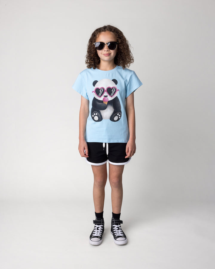 Kid wearing the Icecream Panda Tee in light blue with the Sprint Short in black and white, front view