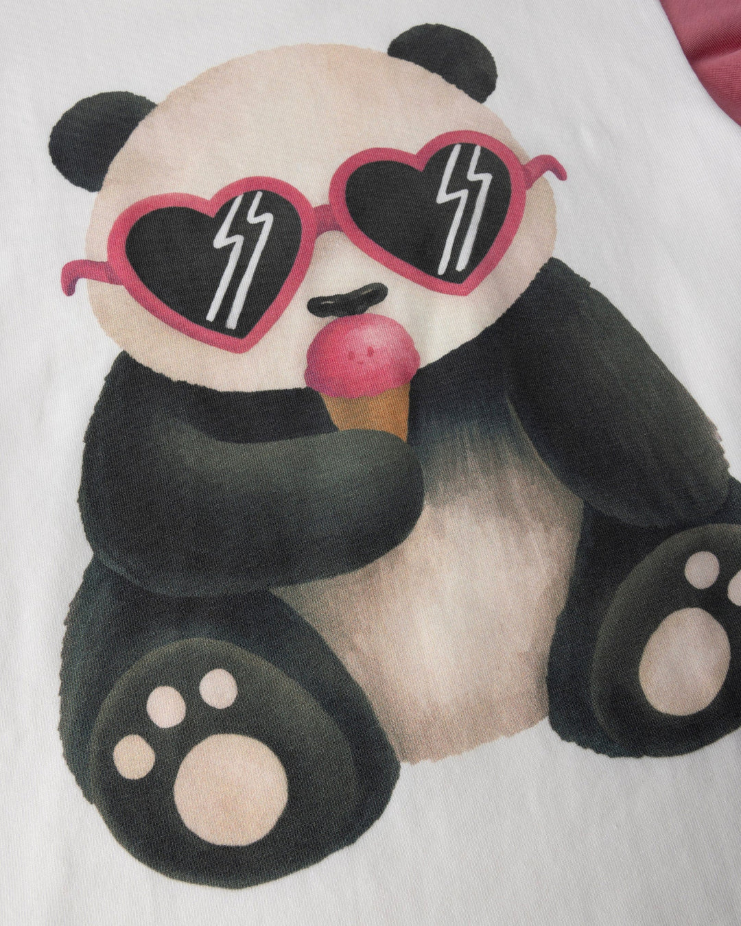 Close up of the Icecream Panda Tee print in white and candy
