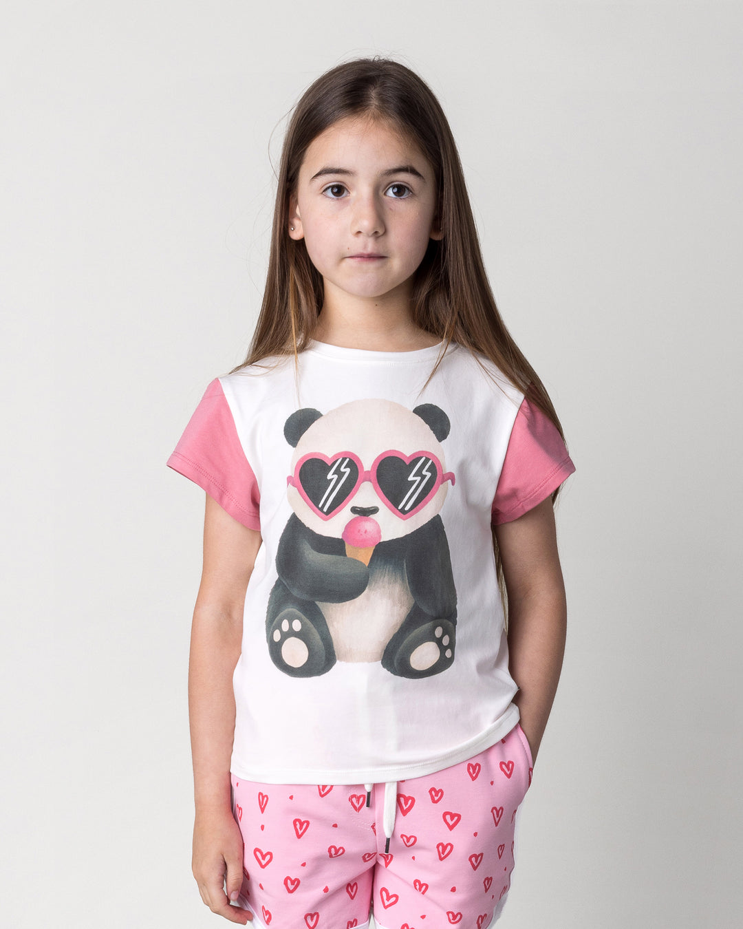 Close up of the Icecream Panda Tee in white and candy on a kid, front view