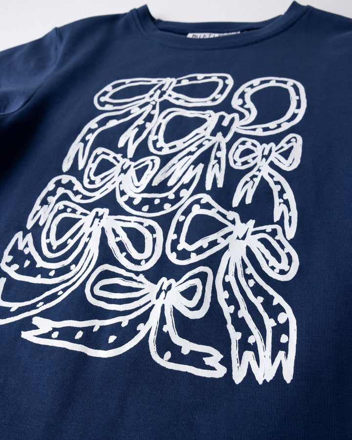 Close up of the Messy Bows Tee print in ink