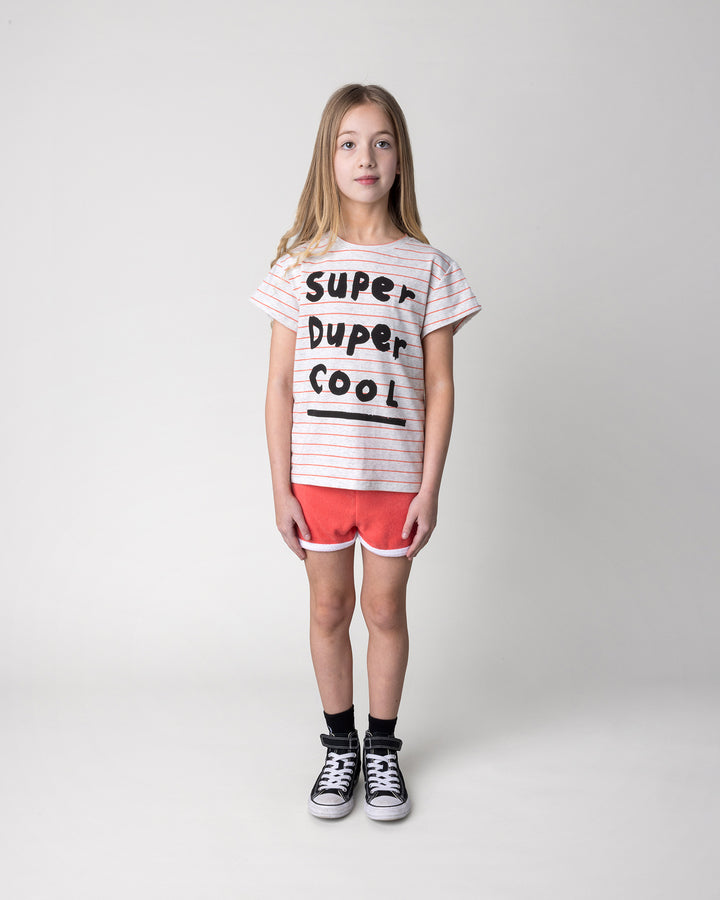Kid wearing the Super Duper Cool Tee in marle and coral stripe with the Track Star Short in tangerine, front view