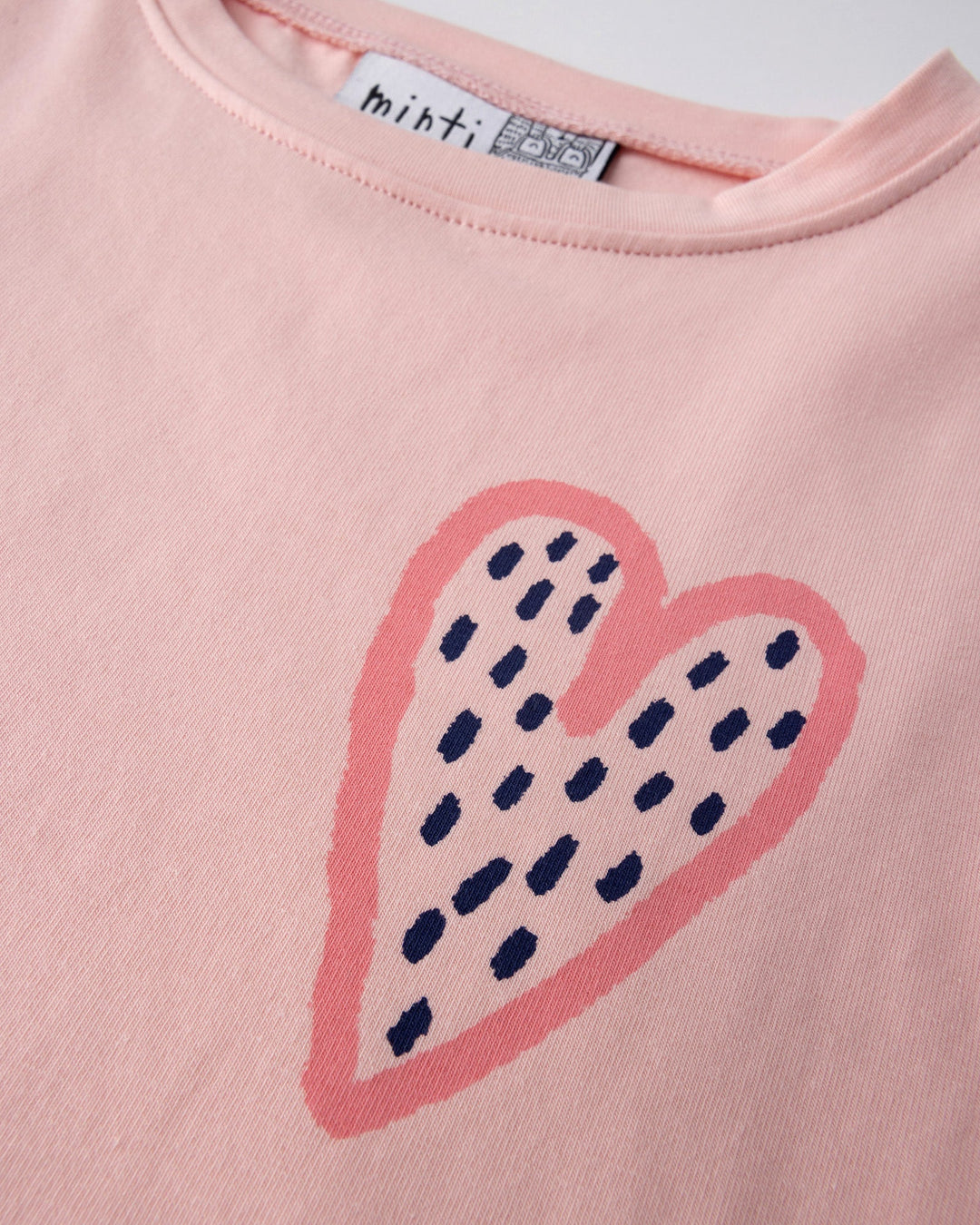 Close up of the Speckle Heart Tee print in pink