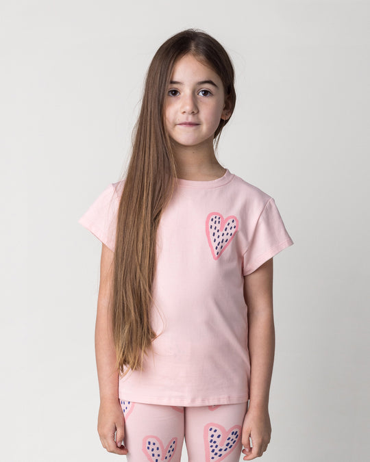 Close up of the Speckle Heart Tee in pink on a kid, front view