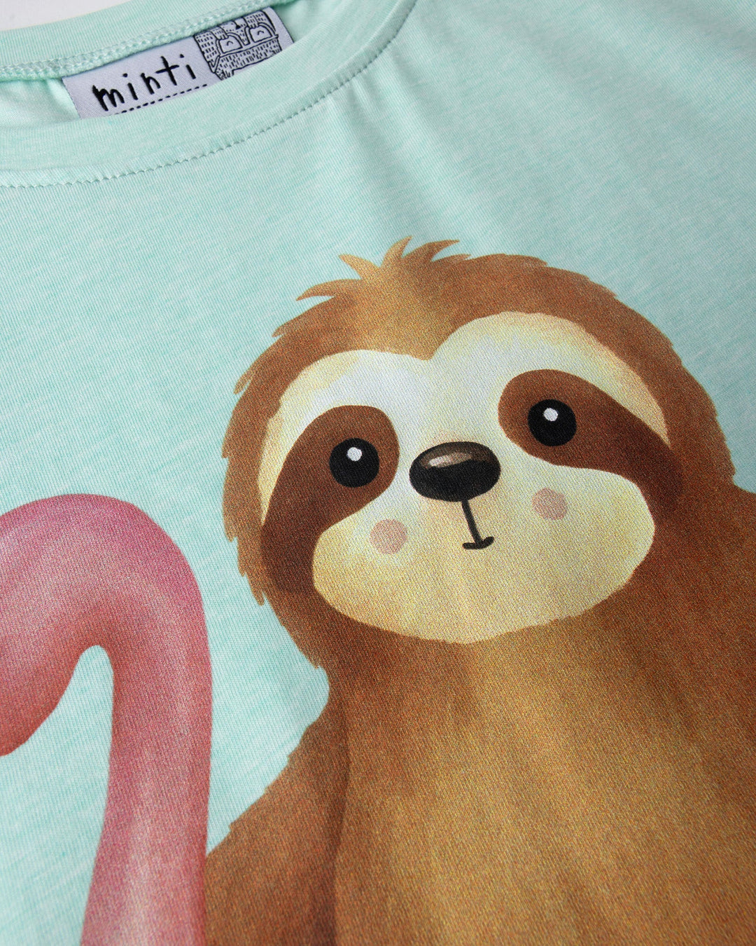 Close up of the Swimming Sloth Tee print in mint marle