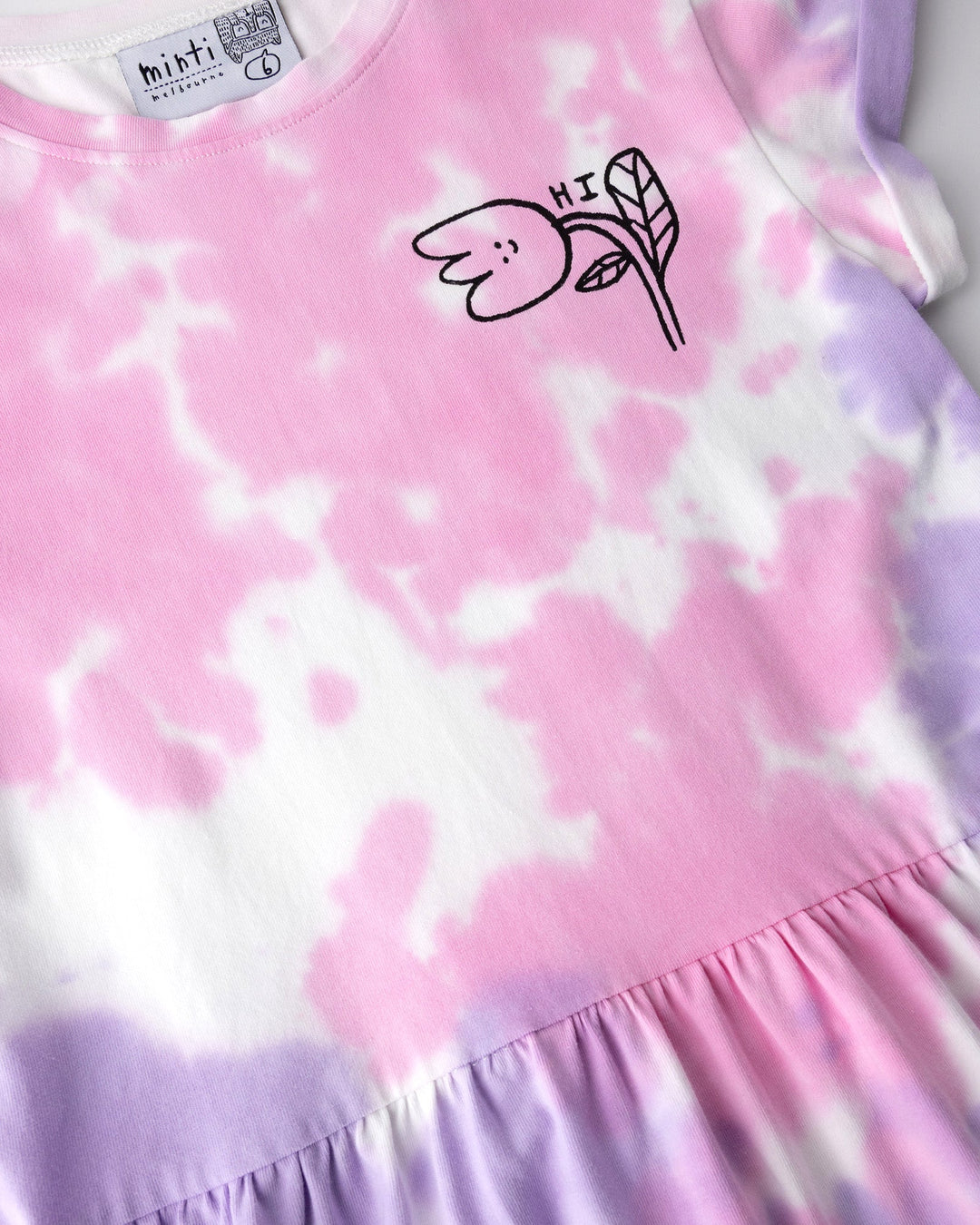 Close up of the Pocket Flower Dress print in tie dye