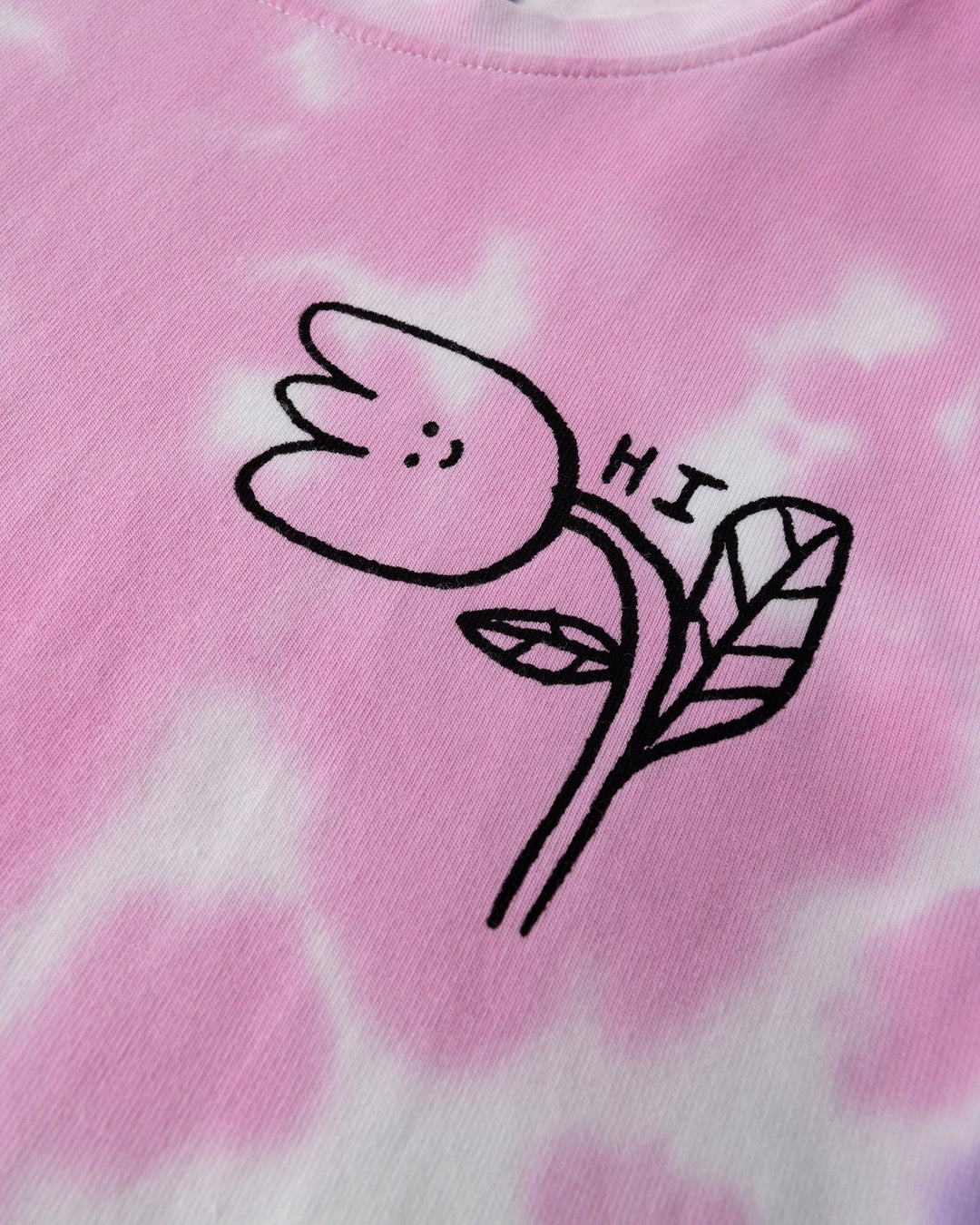 Close up of the Pocket Flower Dress print in tie dye