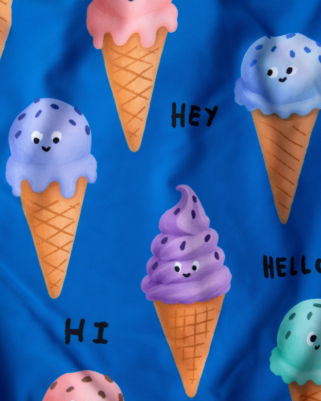 Close up of the Happy Icecreams Swimsuit print in bright blue