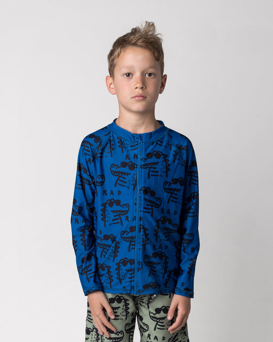 Close up of the Rad Croc Rashie in midnight on a kid, front view