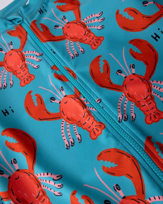 Close up of the Vacay Crayfish Rashie print in teal