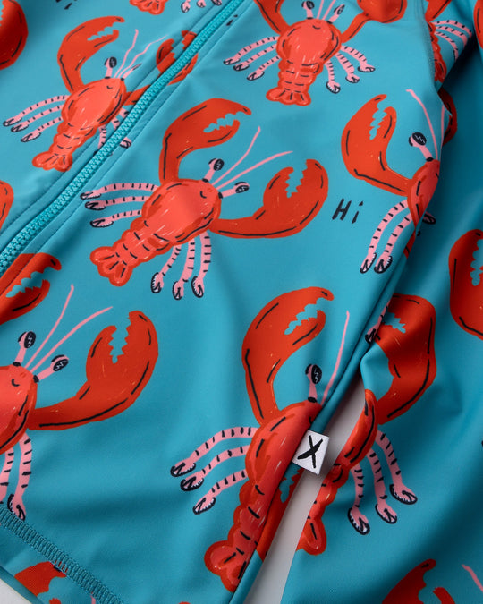 Close up of the Vacay Crayfish Rashie print in teal