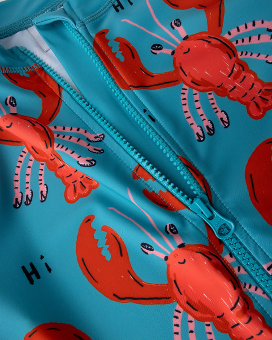 Close up detail of the Vacay Crayfish Rashie in teal