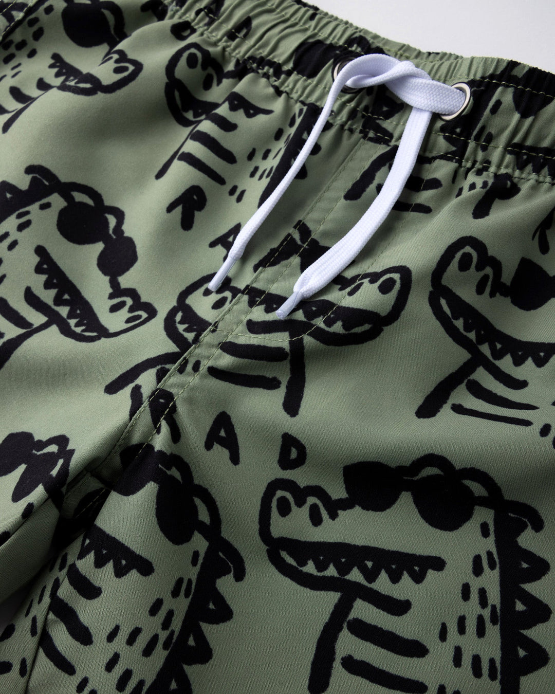Close up detail of the Rad Croc Boardies in khaki
