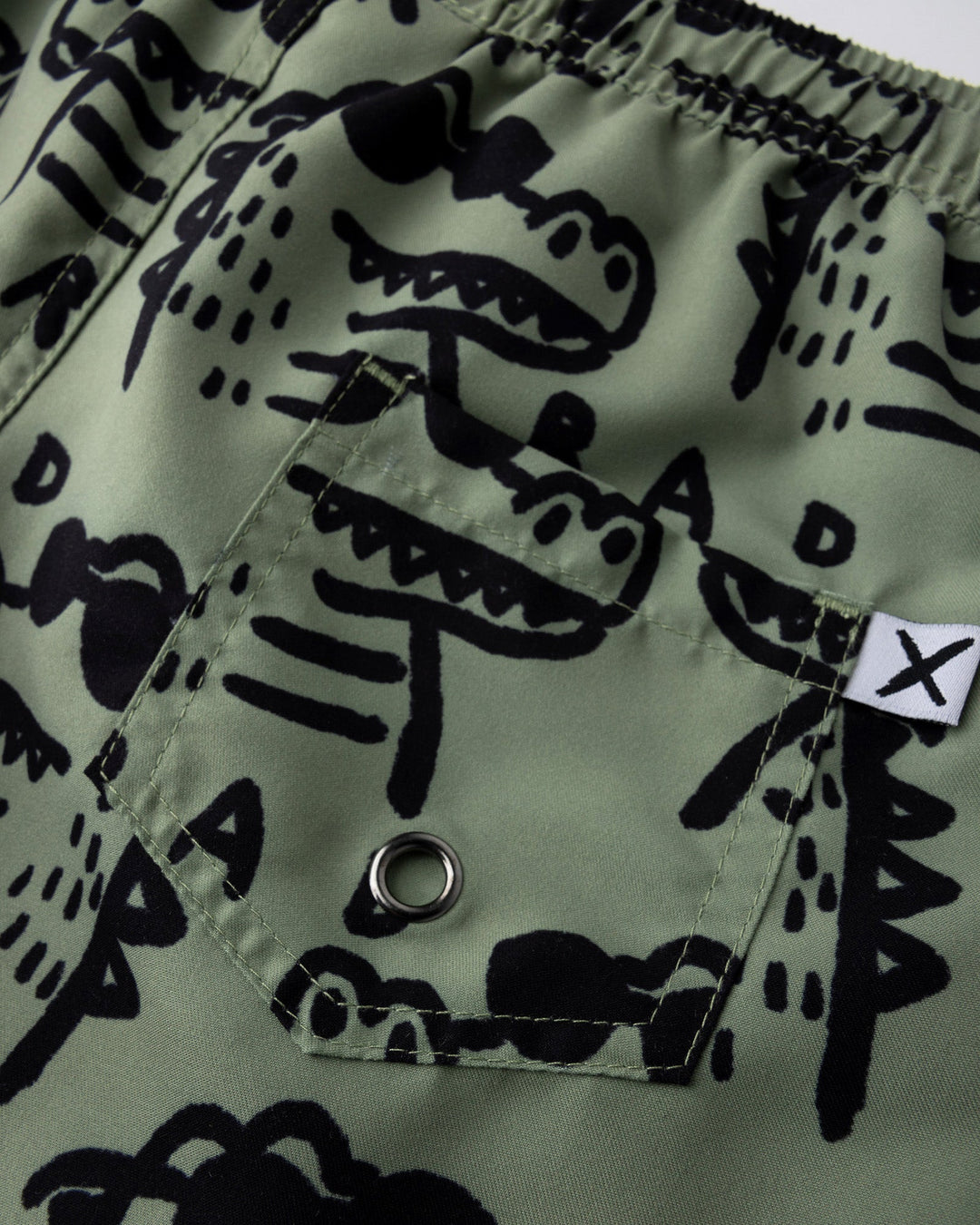 Close up detail of the Rad Croc Boardies in khaki