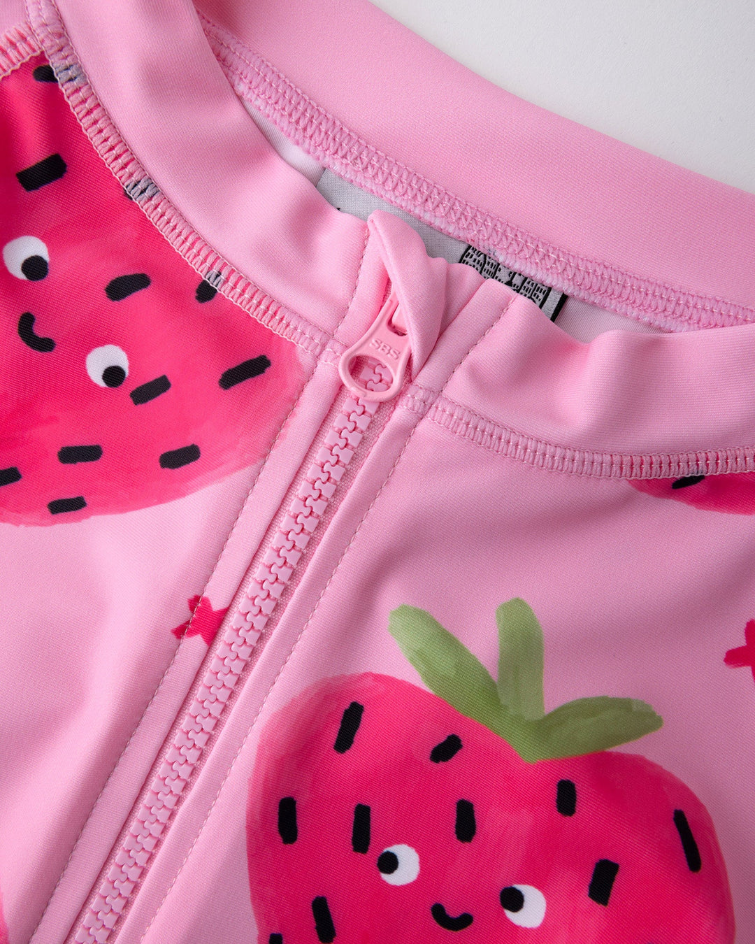 Close up detail of the Happy Strawberry Rashie Set in ballet