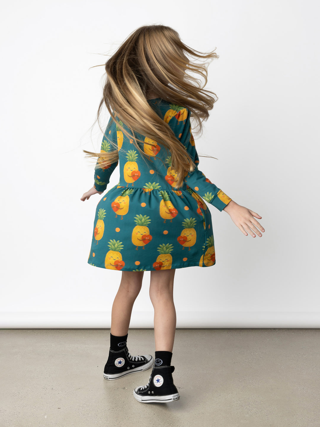 Minti kids clothing. Tshirting weight dress with self cuffs, hidden side pockets and waist seam with ruching detail. 190 Gram // 95% Cotton // 5% Elastane.