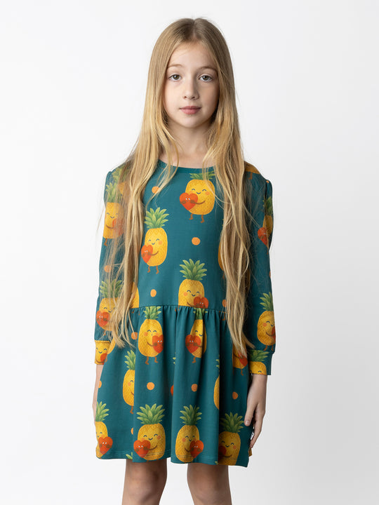 Minti kids clothing. Tshirting weight dress with self cuffs, hidden side pockets and waist seam with ruching detail. 190 Gram // 95% Cotton // 5% Elastane.