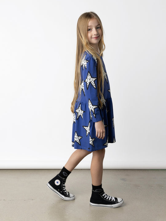 Minti kids clothing. Tshirting weight dress with self cuffs, hidden side pockets and waist seam with ruching detail. 190 Gram // 95% Cotton // 5% Elastane.