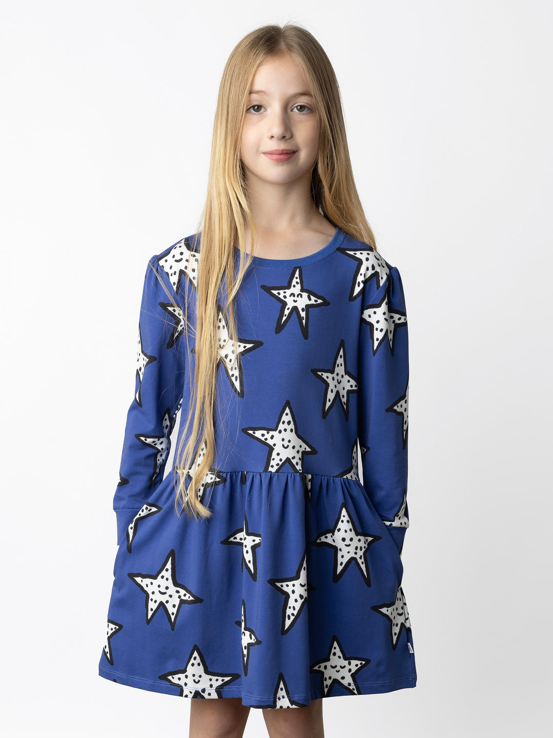 Minti kids clothing. Tshirting weight dress with self cuffs, hidden side pockets and waist seam with ruching detail. 190 Gram // 95% Cotton // 5% Elastane.