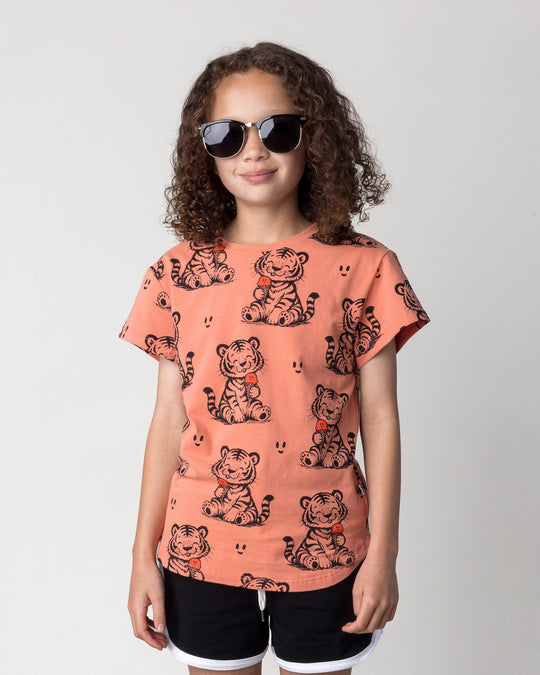 Close up of the Happy Tiger Tee in apricot on a kid, front view
