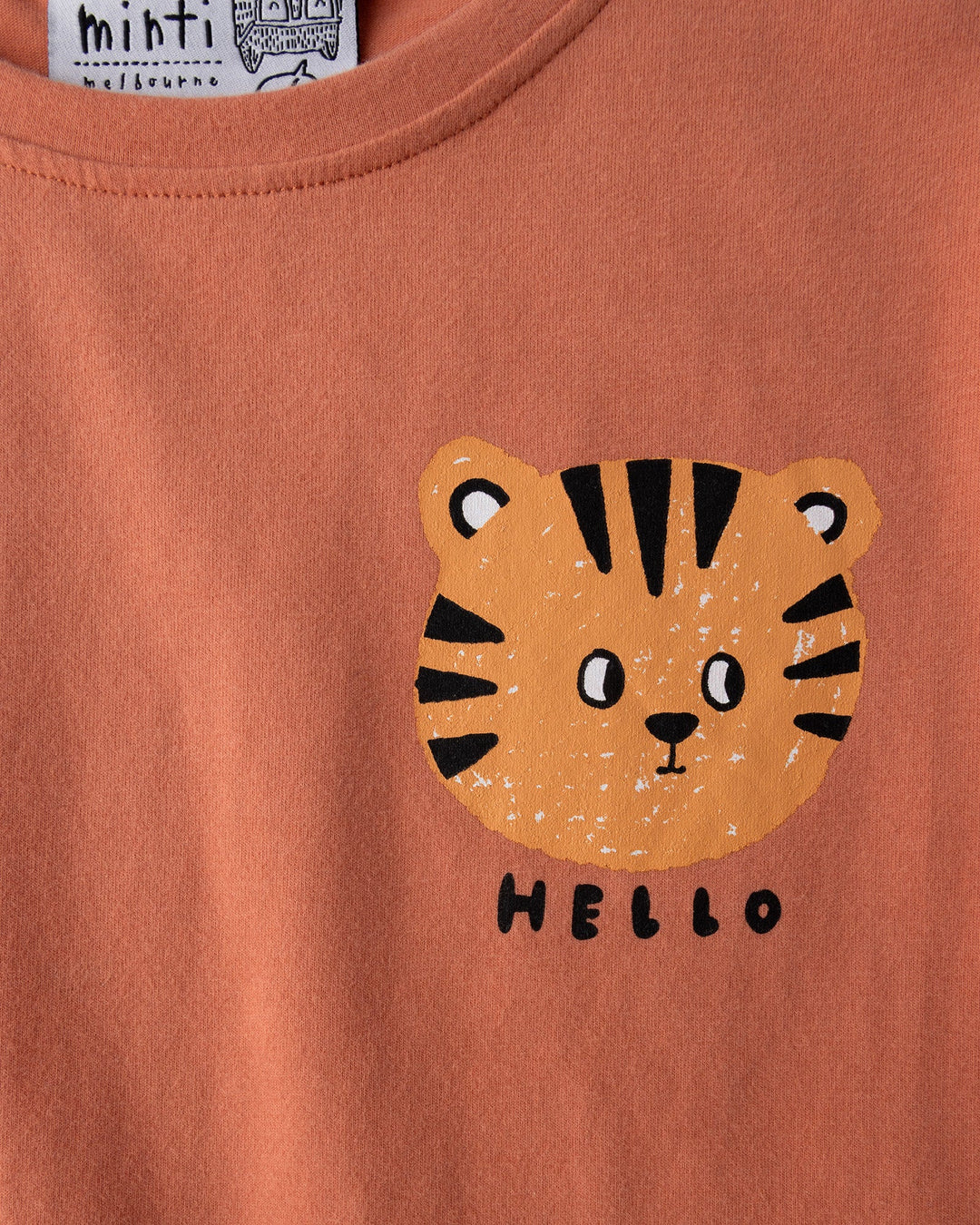 Close up of the Hello Tiger Tee print in apricot