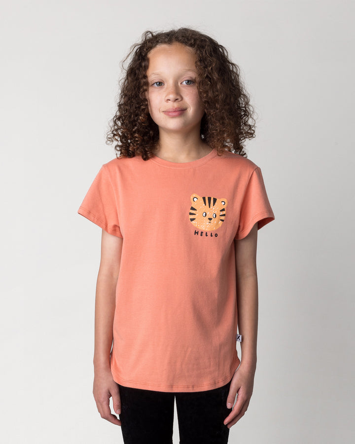 Close up of the Hello Tiger Tee in apricot on a kid, front view