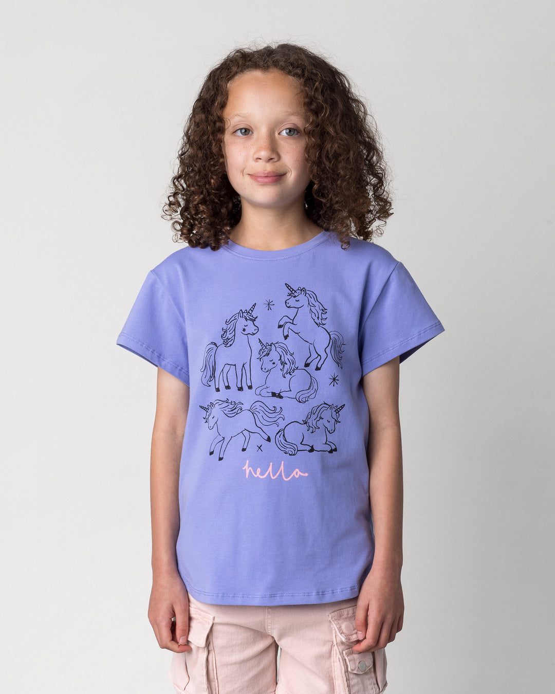 Close up of the Hello Unicorns Tee in purple on a kid, front view