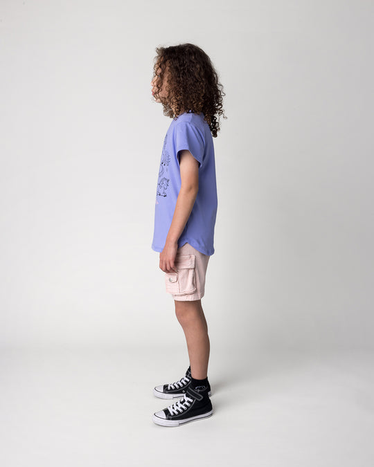Kid wearing the Hello Unicorns Tee in purple, side view