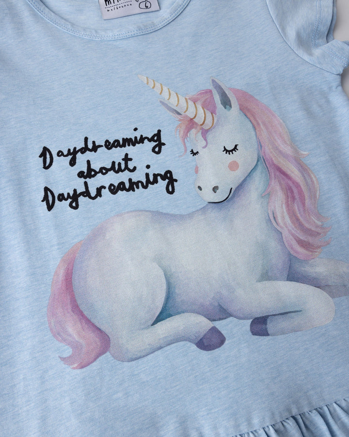 Close up of the Daydreaming Unicorn Dress print in light blue marle
