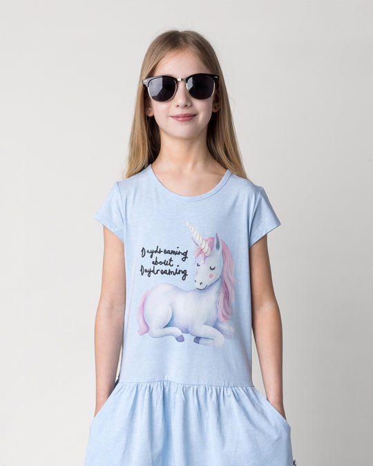 Close up of the Daydreaming Unicorn Dress in light blue marle on a kid, front view