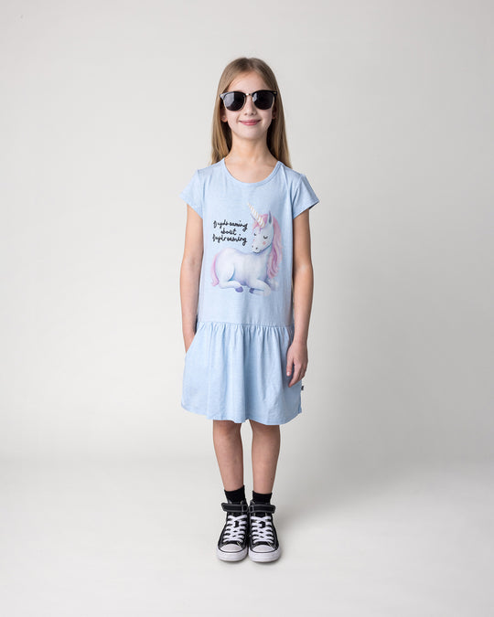 Kid wearing the Daydreaming Unicorn Dress in light blue marle, front view