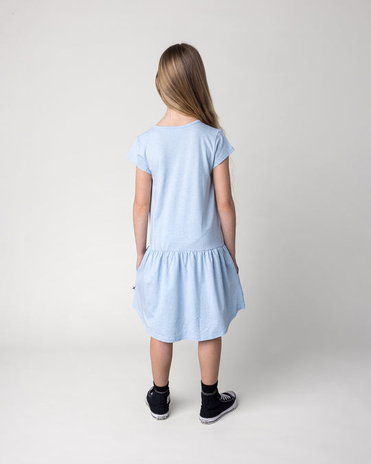 Kid wearing the Daydreaming Unicorn Dress in light blue marle, back view