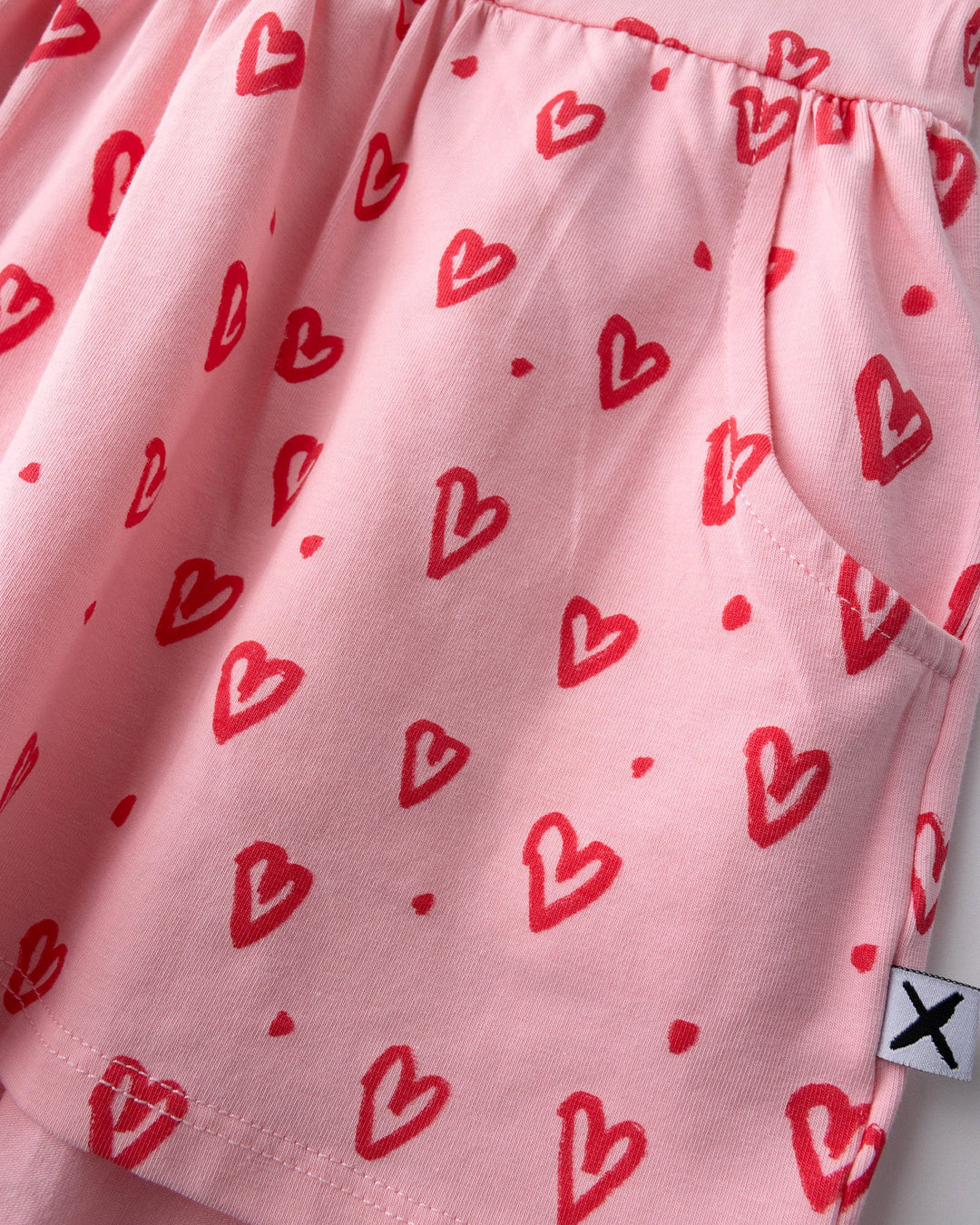 Close up detail of the Hearts Dress in pink