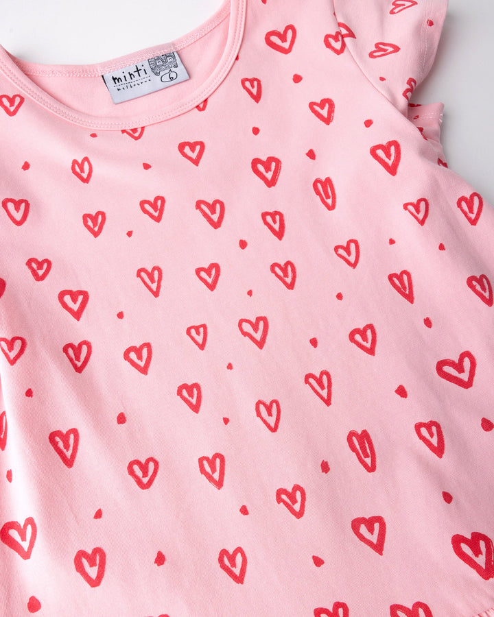 Close up of the Hearts Dress print in pink