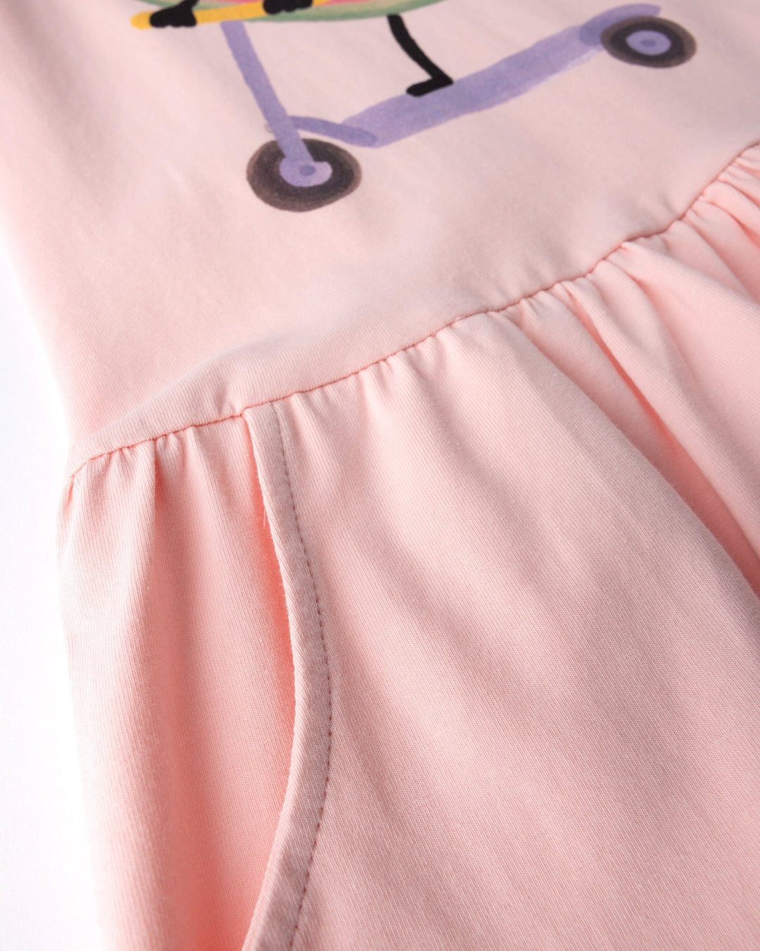 Close up detail of the Scooting Watermelon Dress in light pink