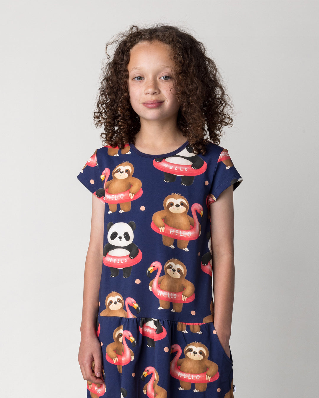 Close up of the Swimming Buddies Dress in midnight on a kid, front view