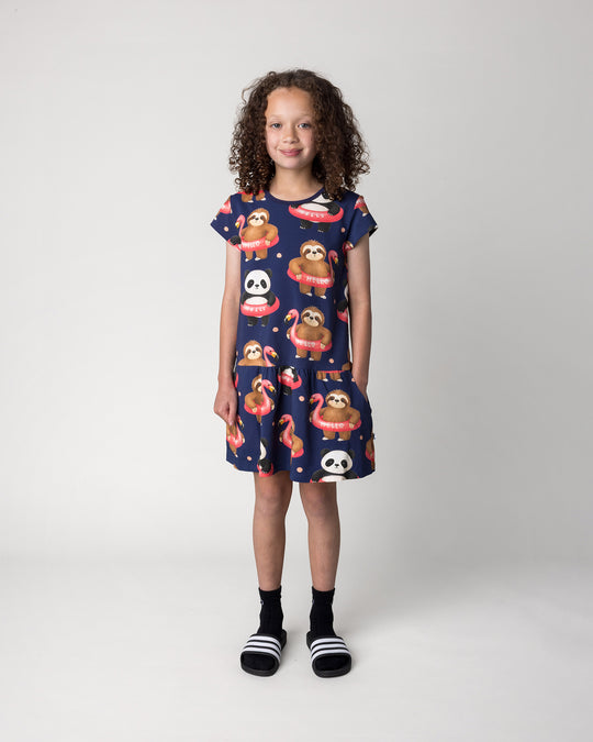 Kid wearing the Swimming Buddies Dress in midnight, front view