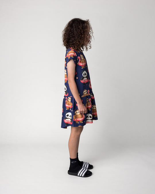 Kid wearing the Swimming Buddies Dress in midnight, side view