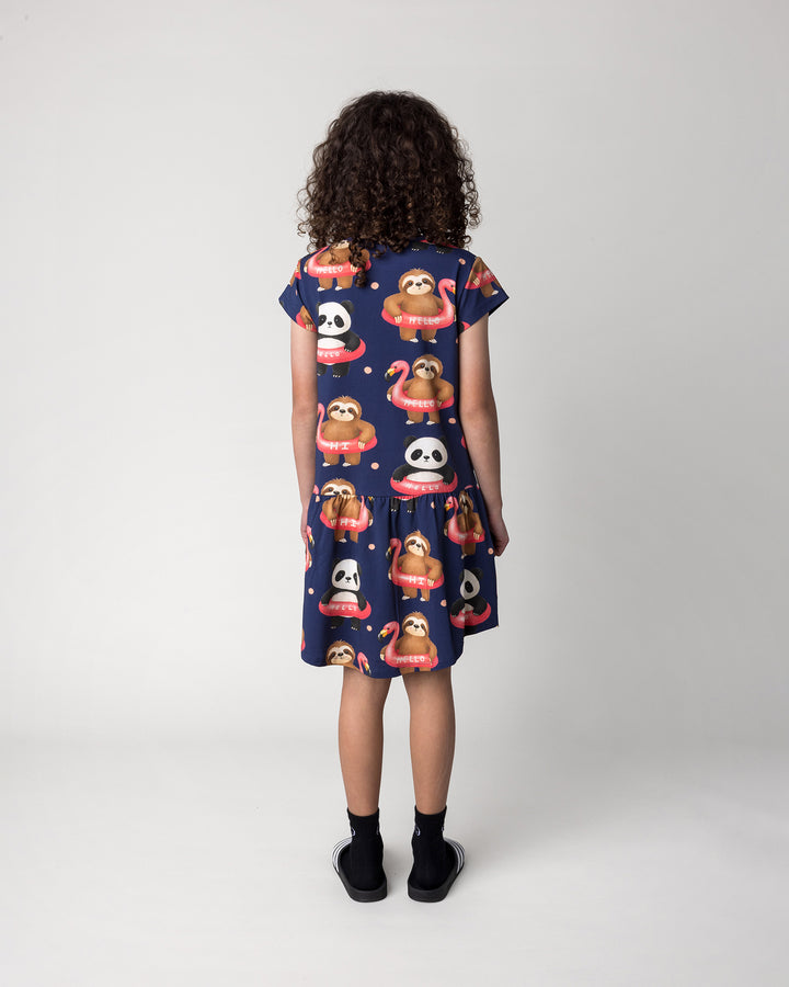 Kid wearing the Swimming Buddies Dress in midnight, back view