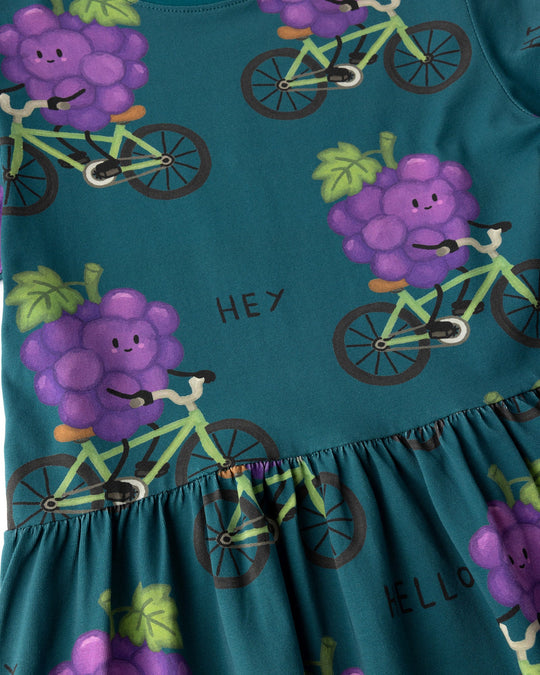 Close up of the Biking Grape Dress print in dark teal