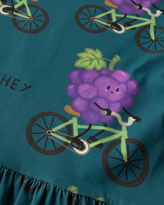 Close up of the Biking Grape Dress print in dark teal