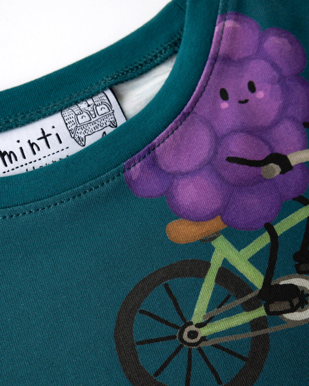 Close up detail of the Biking Grape Dress in dark teal