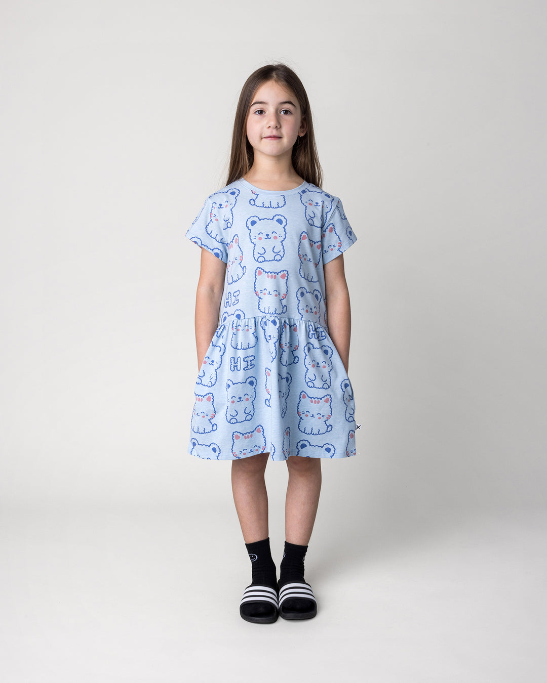 Kid wearing the Hi Cat Bear Dress in light blue marle, front view