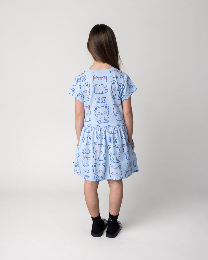 Kid wearing the Hi Cat Bear Dress in light blue marle, back view