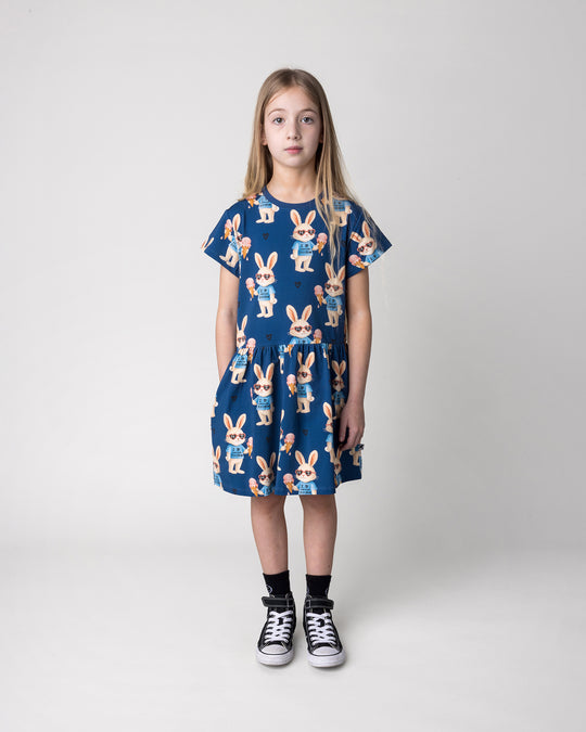 Kid wearing the Icecream Bunny Dress in blue, front view