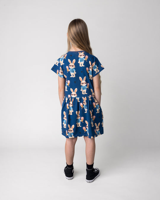 Kid wearing the Icecream Bunny Dress in blue, back view