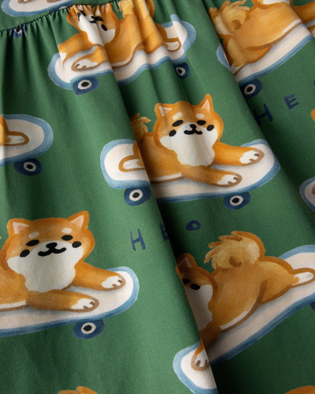 Close up of the Skate Puppy Dress print in turf