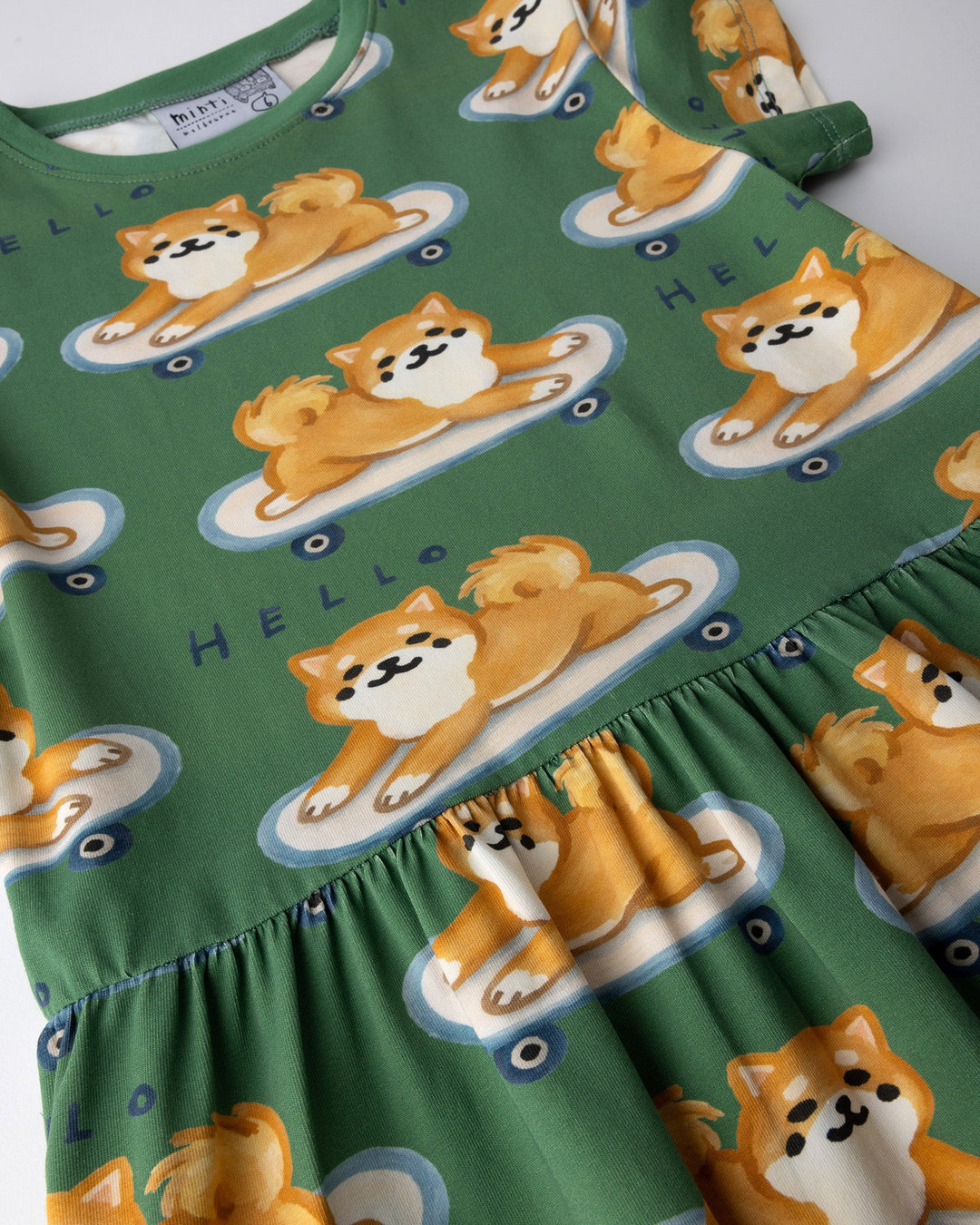 Close up of the Skate Puppy Dress print in turf